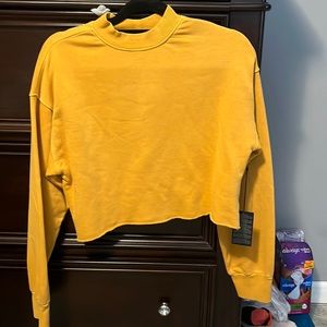yellow cropped crew neck from Forever 21 in size M.